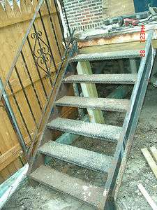 USED WROUGHT IRON STAIRS AND TWO SIDE RAILS .GOOD CONDITION  