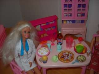 You are buying a Barbie  Mattel Kitchen Table, Chairs, Cabinets, and 