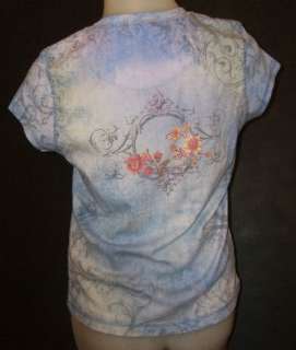 Womens size medium artsy print shirt is 50% cotton, 50% polyester.