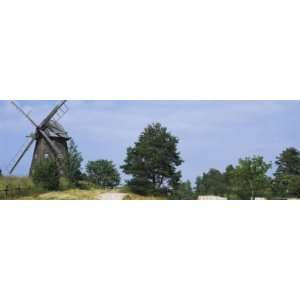  Hay Bale in a Field with a Traditional Windmill in the 