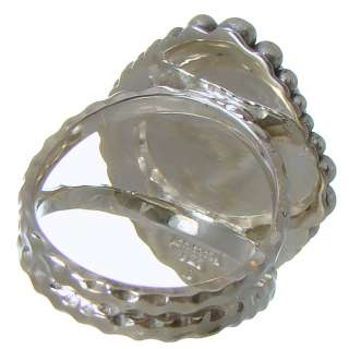 Sterling Silver Mabe Pearl ring. The ring is accented by sterling 